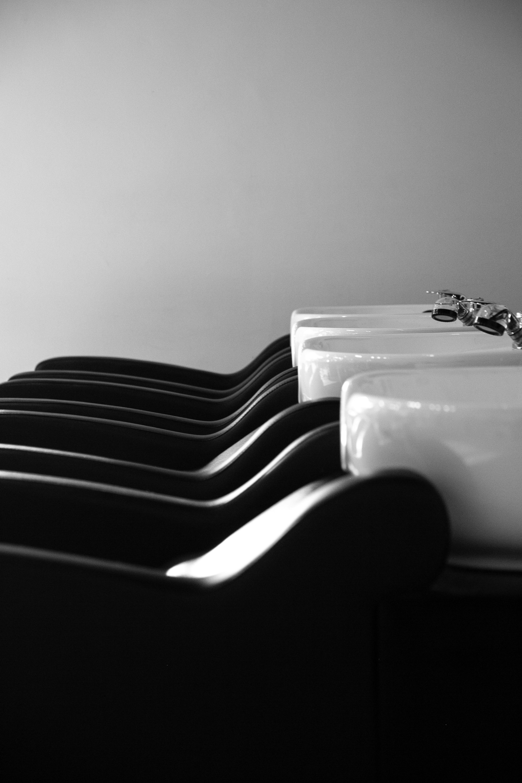A black-and-white view of the wash basins