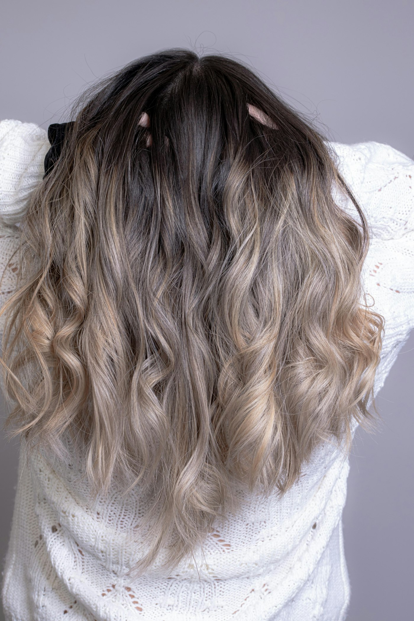 Softly blended balayage colour through long wavy hair