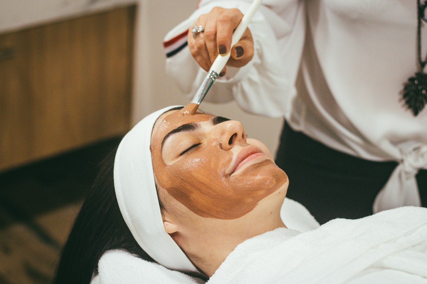 A client receiving a professional facial treatment
