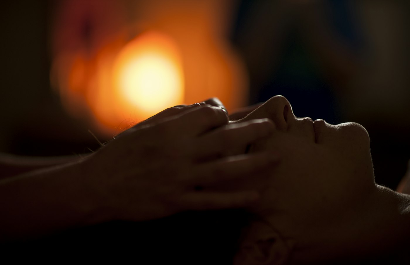 Warm, low-lit spa massage treatment